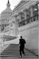 Sen. Barack Obama runs up the steps of the U.S. Capitol.