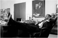 Relaxed while reading in his office.