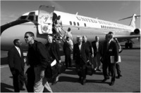 Disembarking from the military plane.